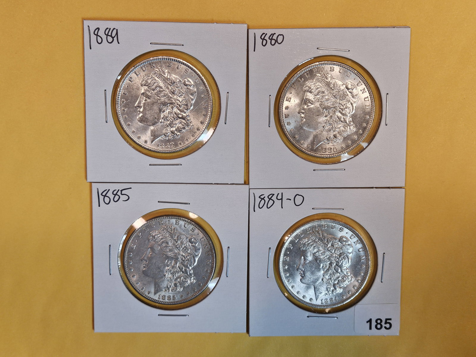 Four Brilliant About Uncirculated plus Morgan Silver Dollars (1 of 3)