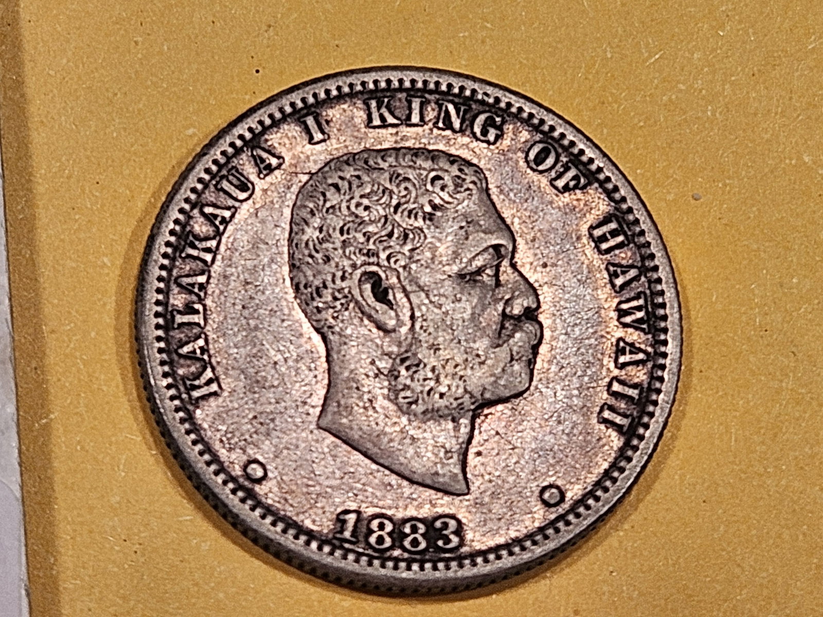 * Scarcer 1883 Hawaii 25 cents in Extra Fine: Trace amounts of original luster