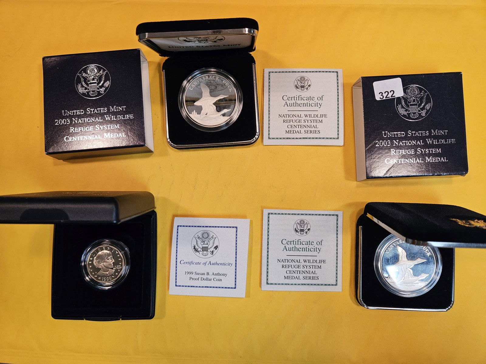 Three GEM Proof Deep Cameo US Mint Products: KEY DATE 1999 SBA Dollar and Two 2003 Silver Medals