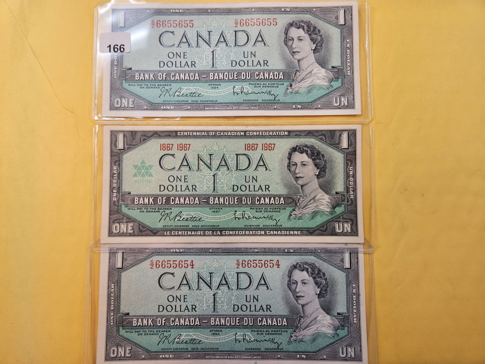 Three Canadian One Dollar Notes (1 of 5)