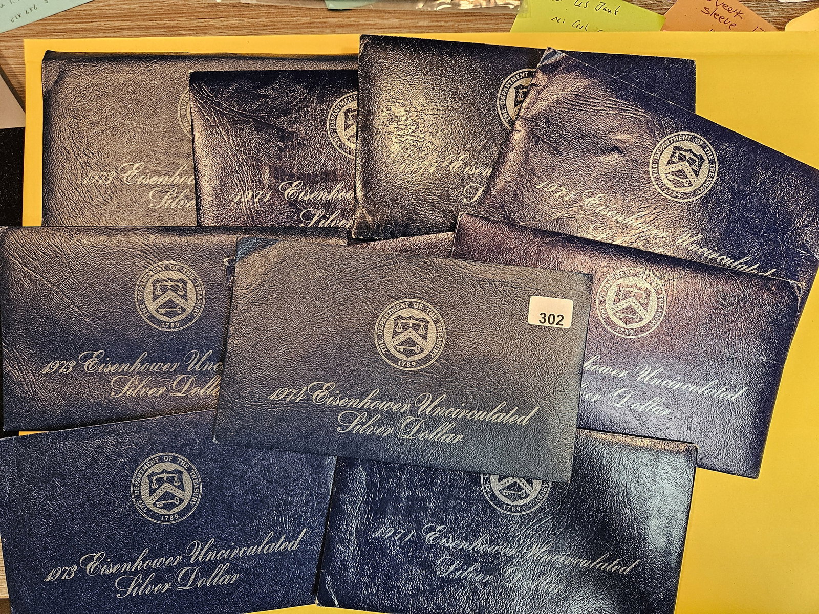 Ten, mixed, GEM Brilliant Uncirculated SILVER BLUE IKE sets (1 of 1)