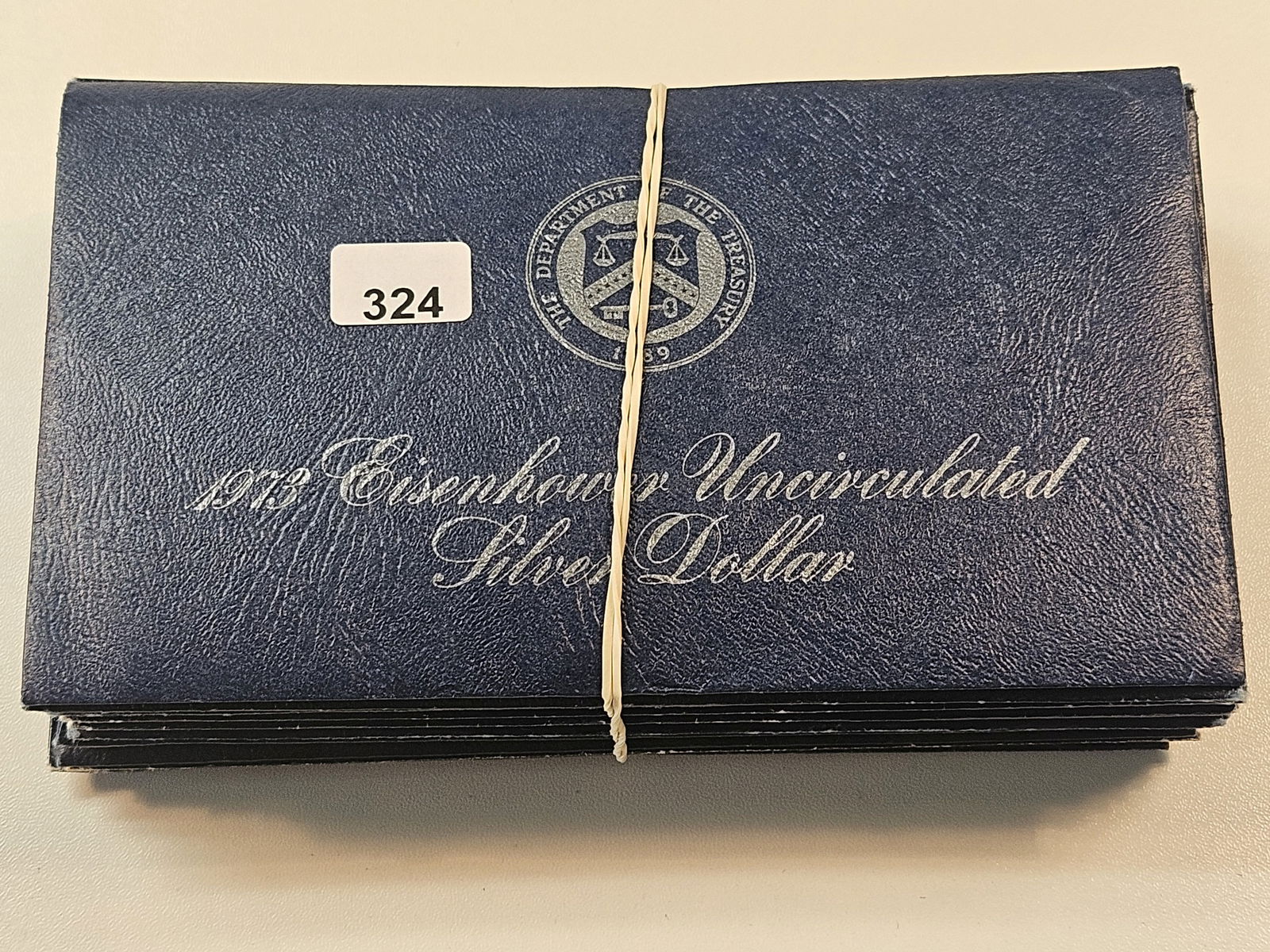 Ten Mixed Date Uncirculated Eisenhower Silver Dollars (1 of 3)