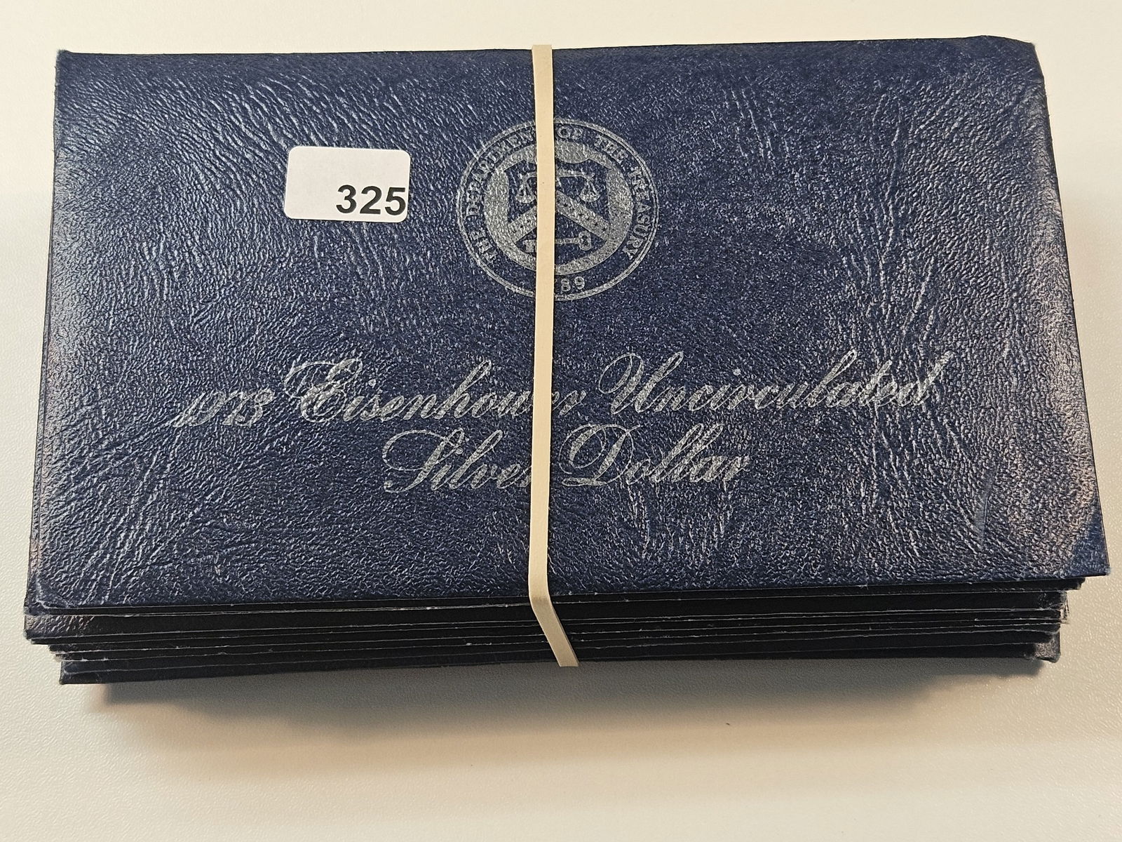 Ten Mixed Date Uncirculated Eisenhower Silver Dollars (1 of 3)