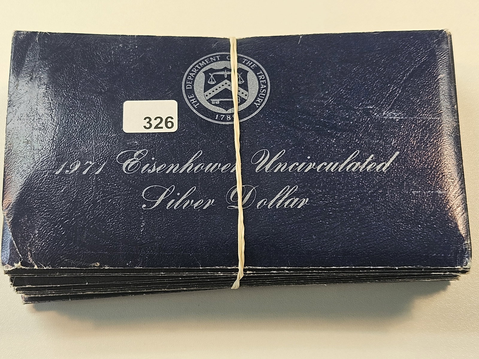 Ten Mixed Date Uncirculated Eisenhower Silver Dollars (1 of 3)