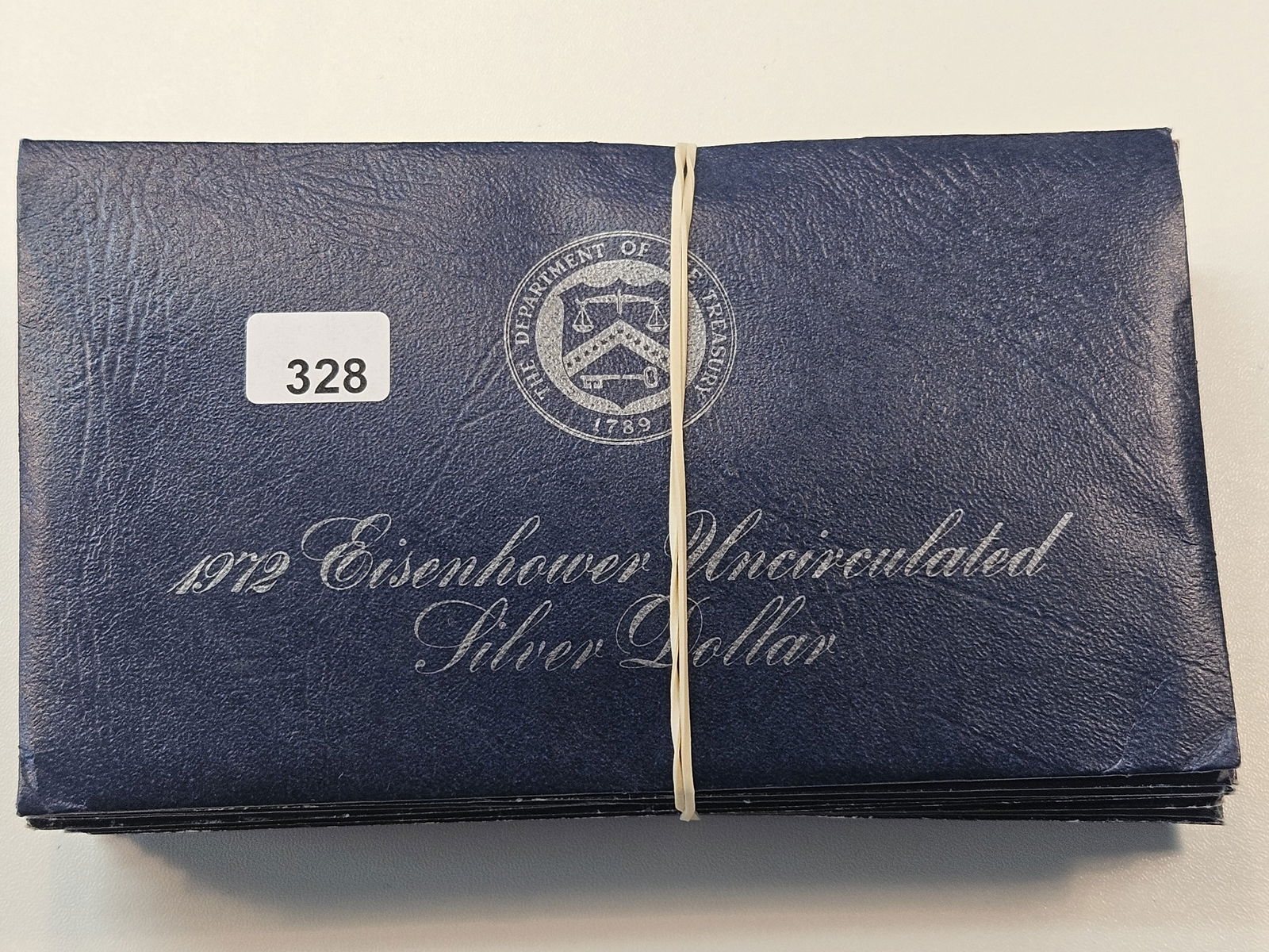 Ten Mixed Date Uncirculated Eisenhower Silver Dollars (1 of 3)