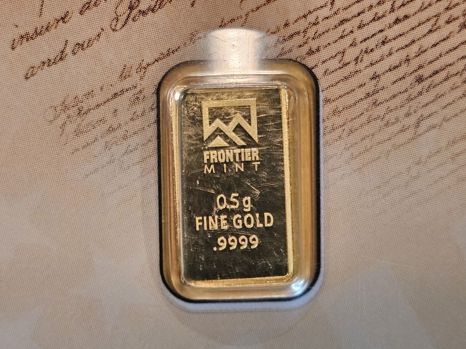 GOLD! Frontier Mint .9999 fine one-half gram Gold Bar: In We The People plastic holder