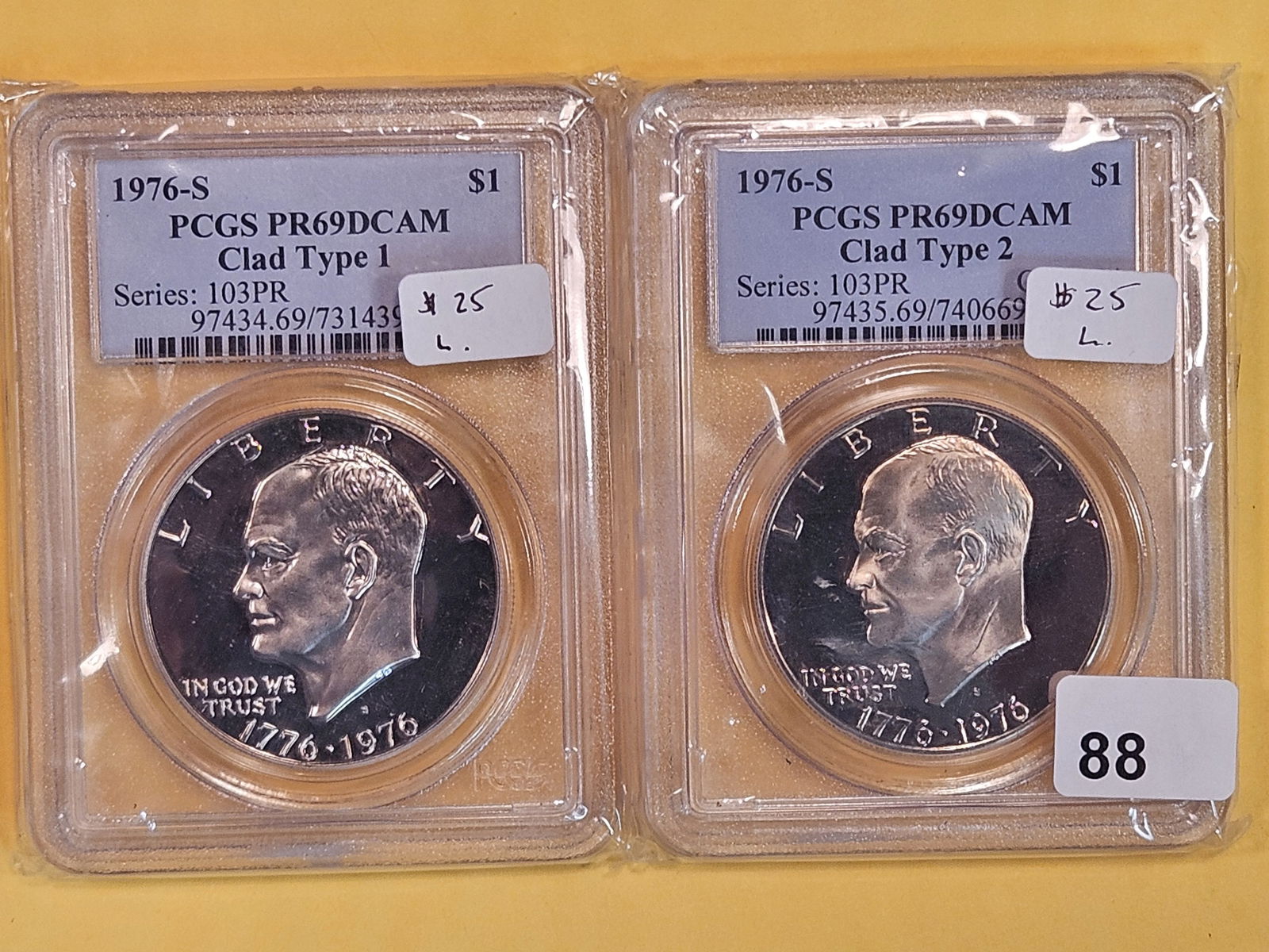 Two Near-Perfect PCGS-graded clad Eisenhower Dollars (1 of 2)