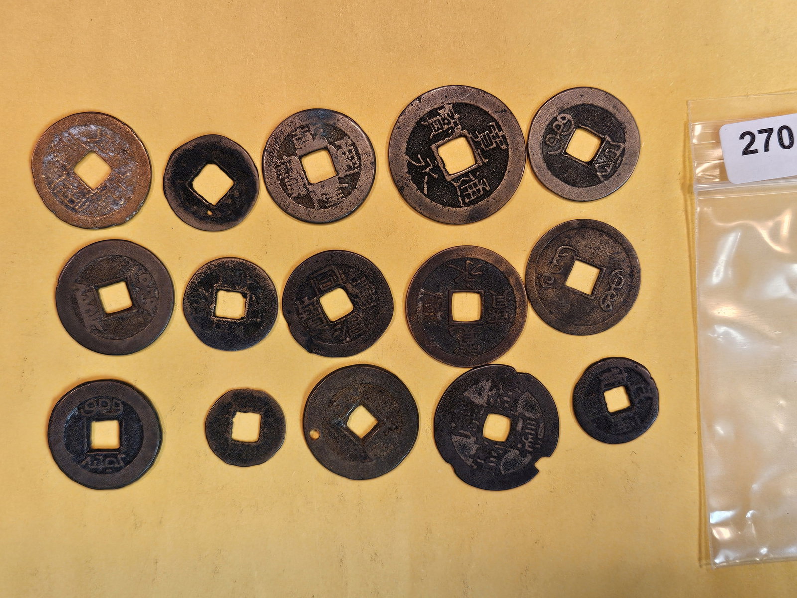 Fifteen mixed Asian coins (1 of 3)