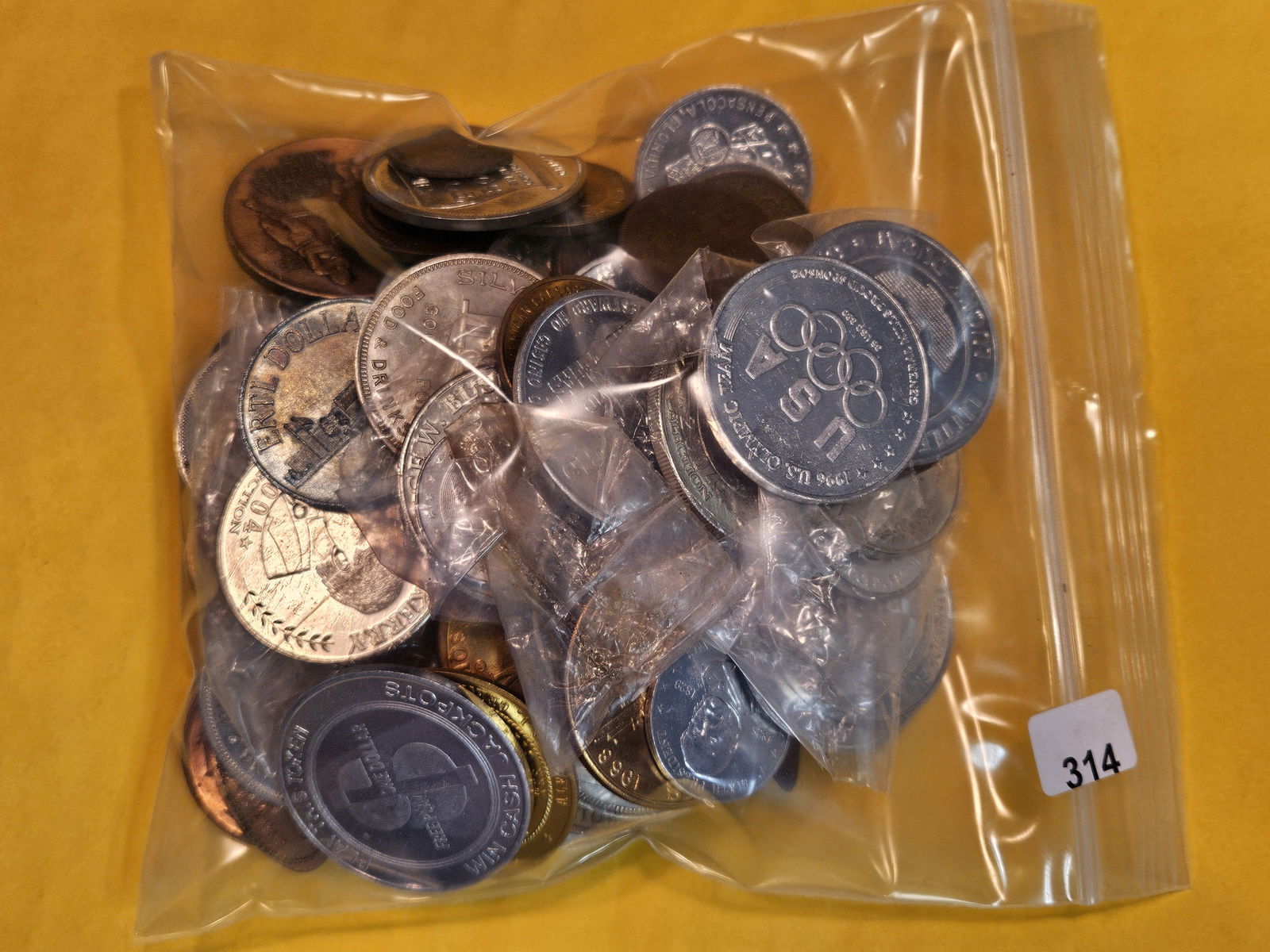 TWO pounds of mixed Exonumia (1 of 2)