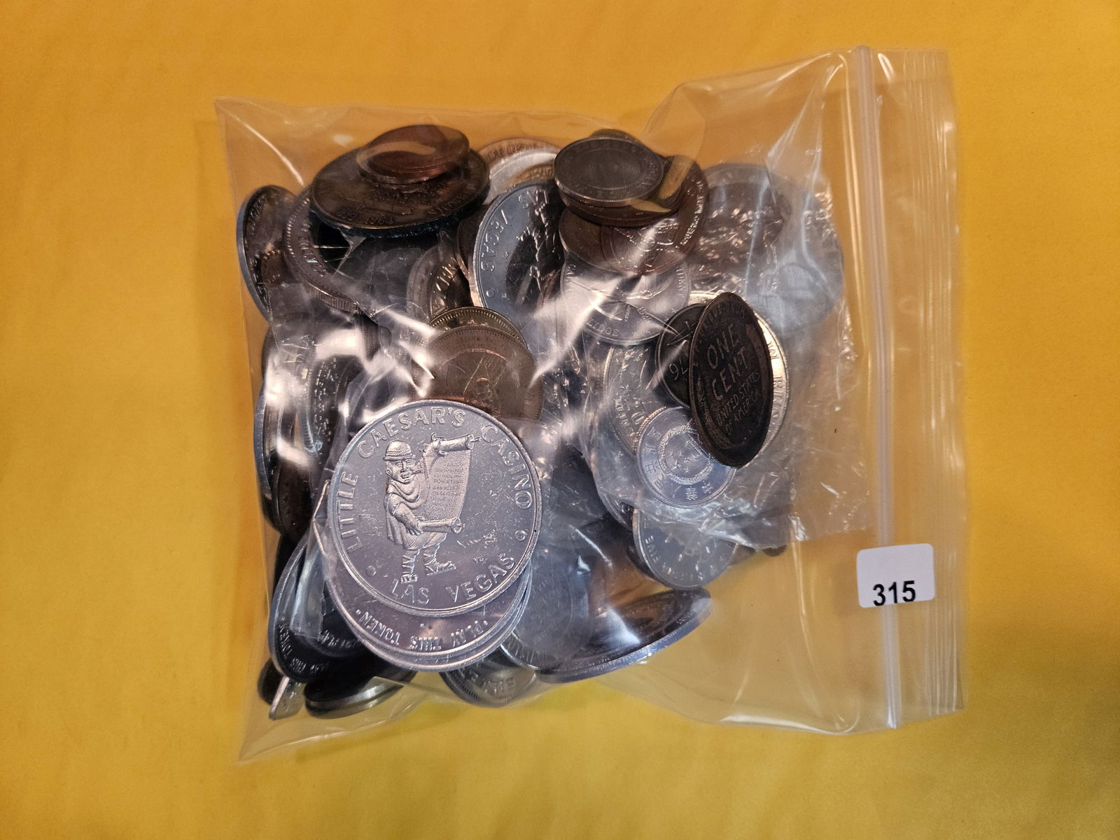 TWO pounds of mixed Exonumia (1 of 2)