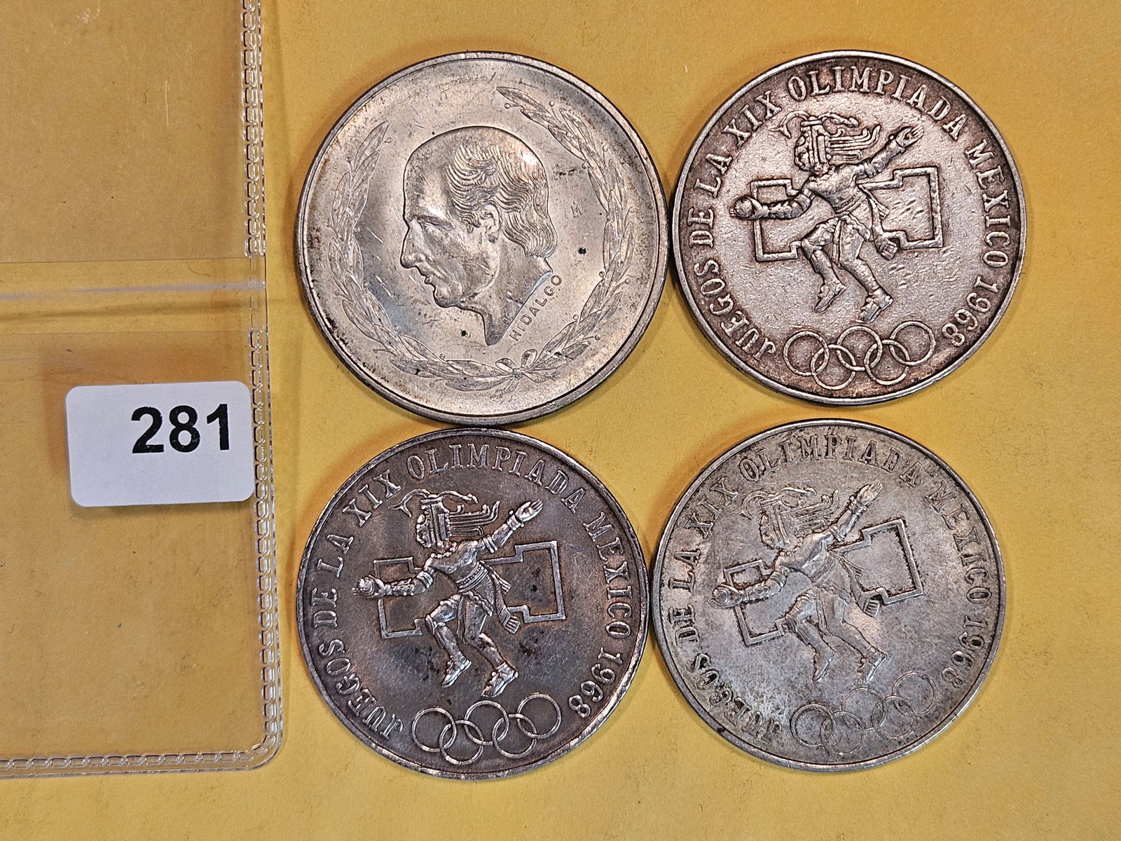 Four larger, Mexican, silver coins (1 of 2)