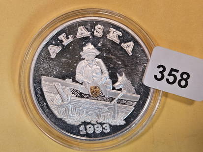 SILVER & GOLD! One troy ounce .999 fine silver round with GOLD NUGGET!: Alaska. The ones I've seen like this have usually been described with the nugget weighing one gram. Not sure if this one does, but looks pretty close