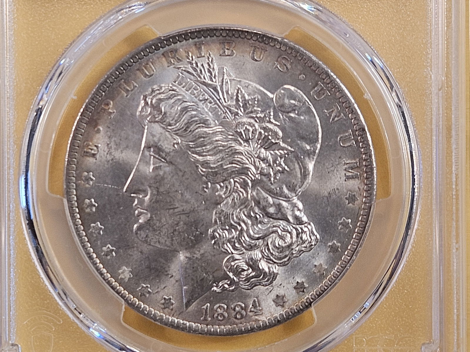 PCGS 1884-O Morgan Silver Dollar in Mint State 62 (1 of 4)