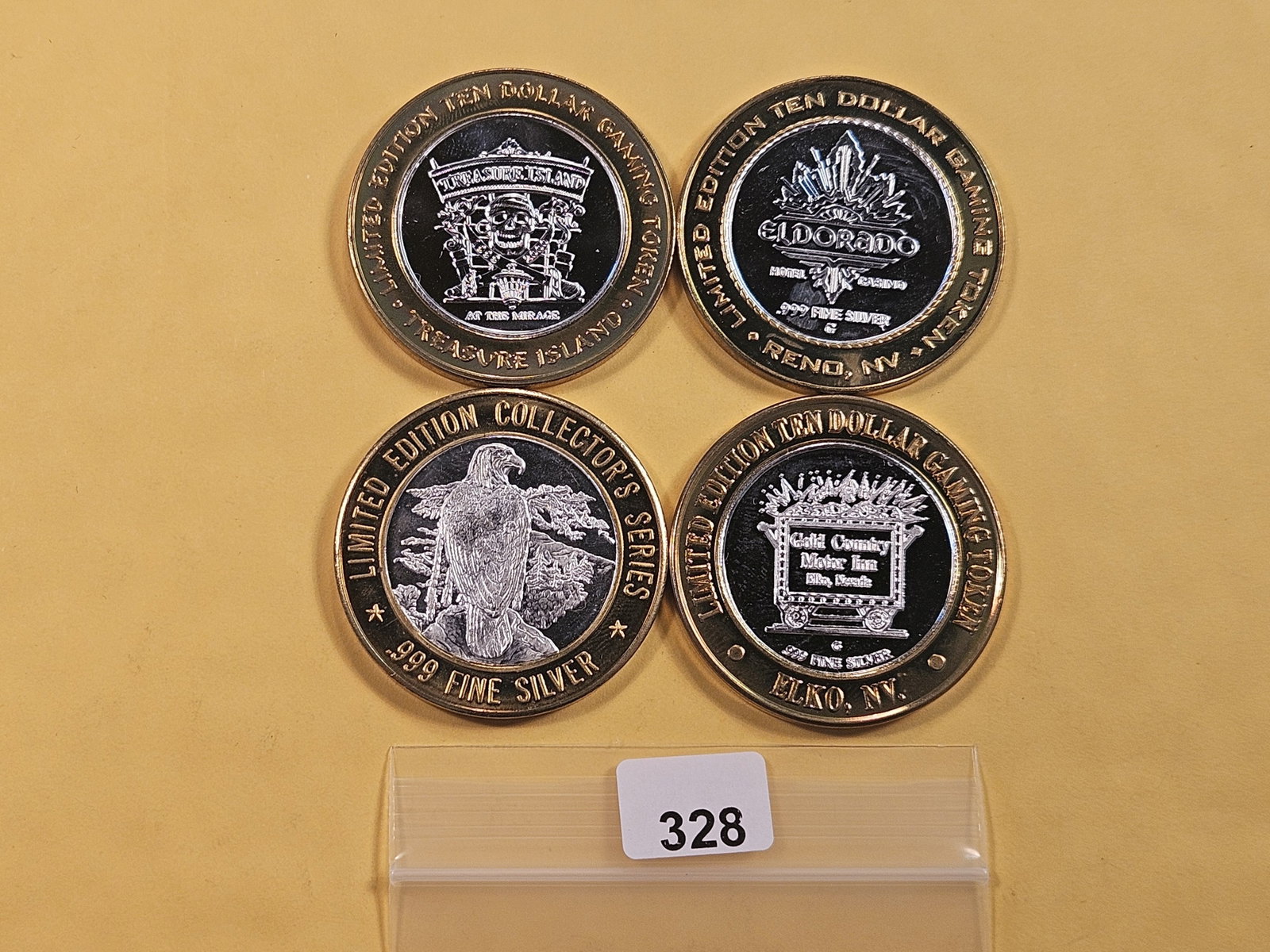 Four Silver Ten Dollar Casino Gaming Tokens: .999 fine Silver centers in brass ring