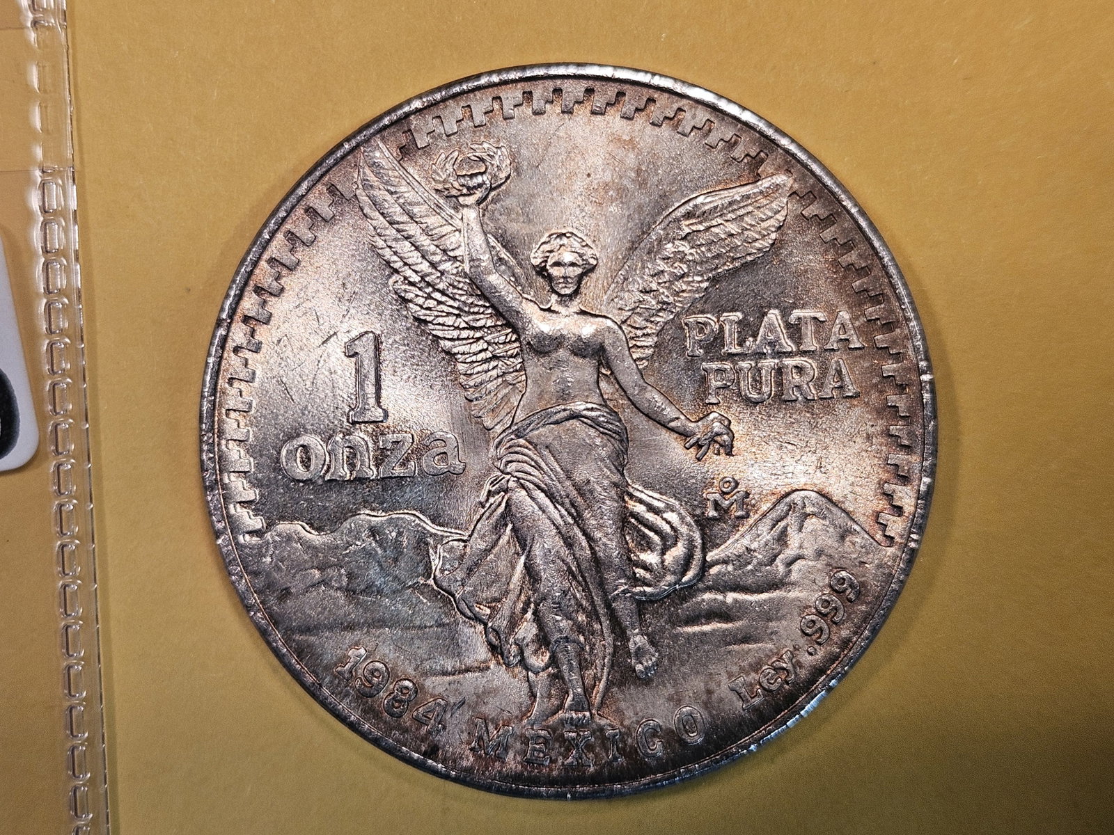 GEM Brilliant Uncirculated 1984 Mexico silver Onza: Libertad. Toned