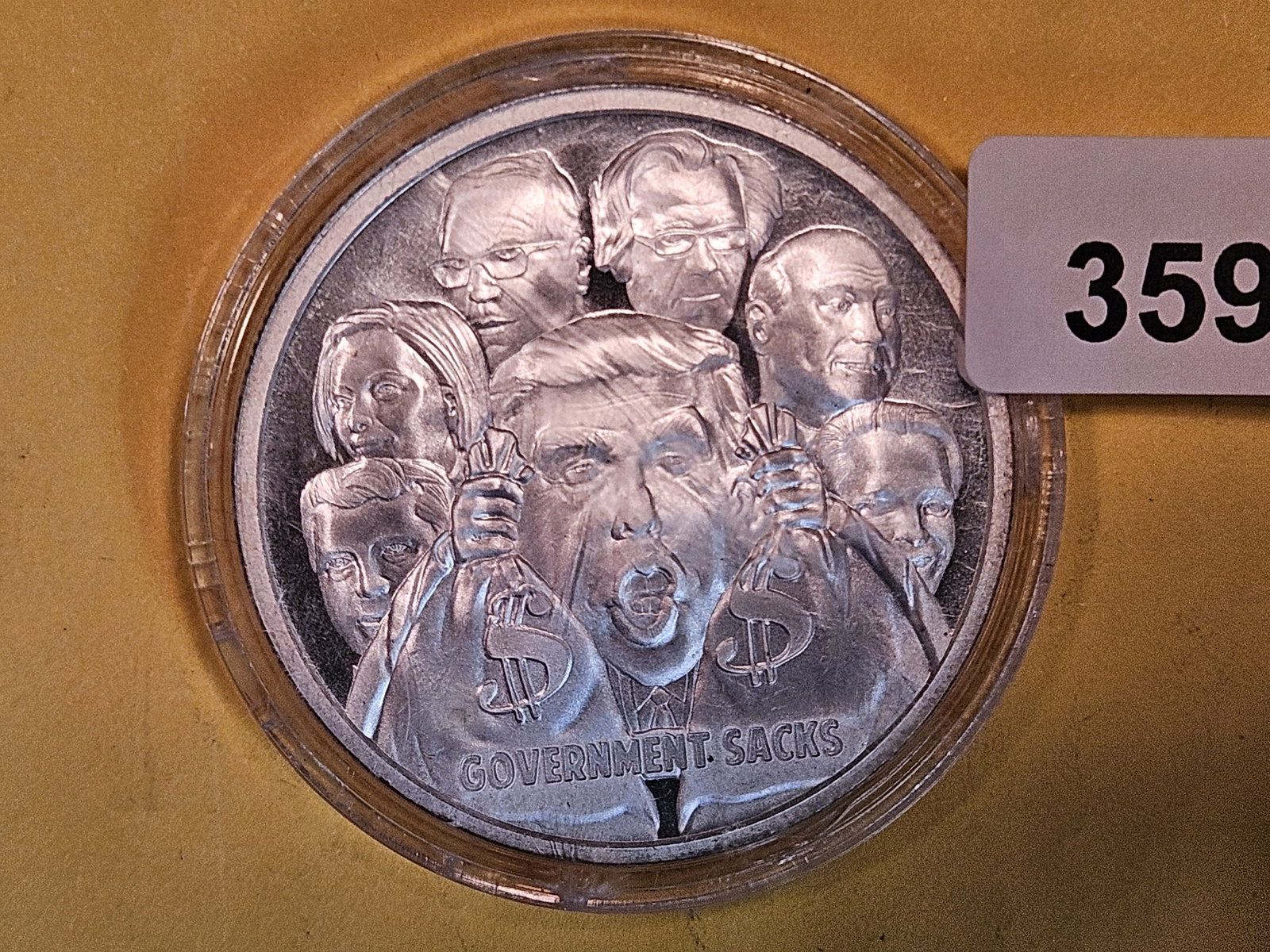 One Troy ounce .999 fine silver proof art round: Government sacks