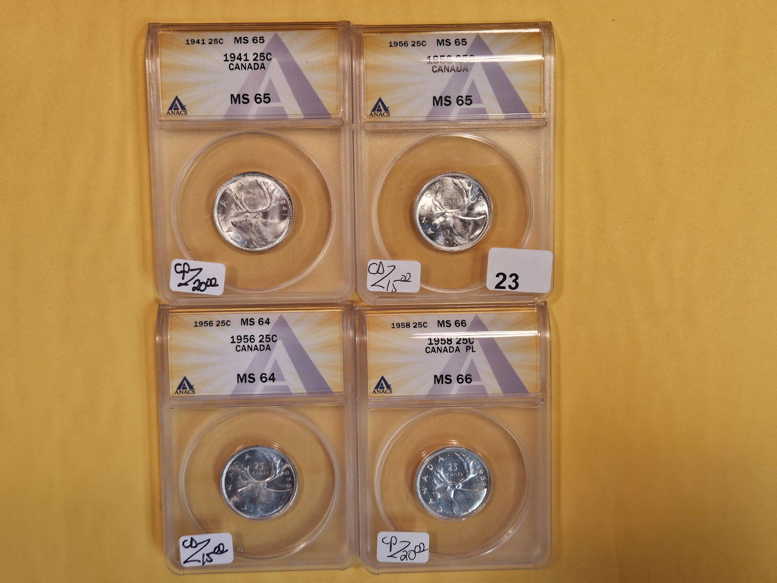 Four ANACS-graded silver Canadaian 25 cent pieces (1 of 4)