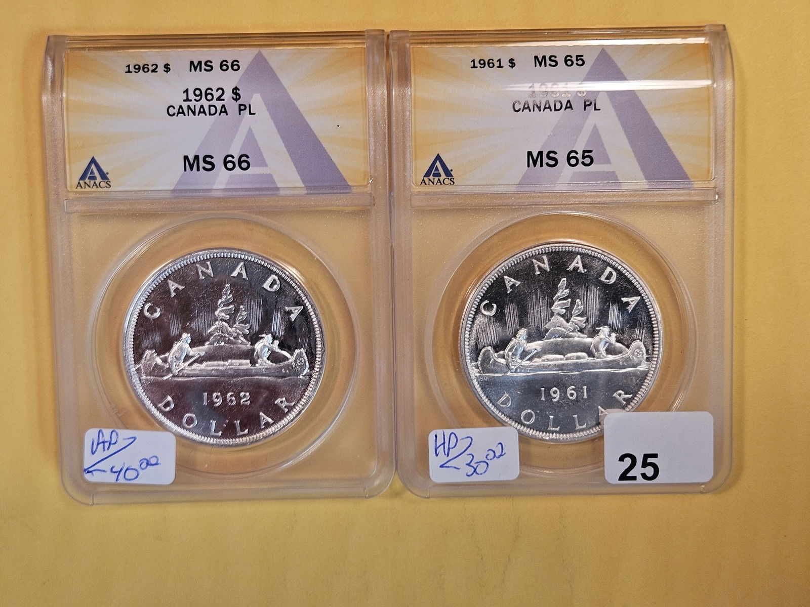 Two GEM, ANACS-graded silver Prooflike dollars (1 of 2)