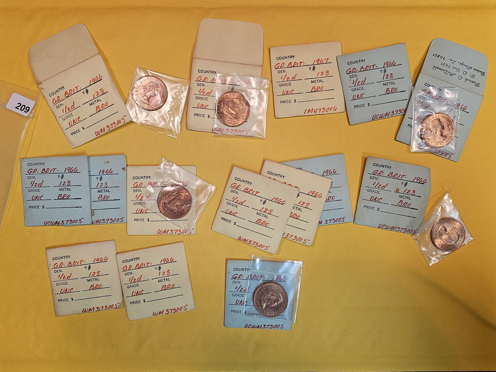 Fifteen Brilliant Uncirculated Red Great Britain 1/2 pennies: All in flips. All BU RED!