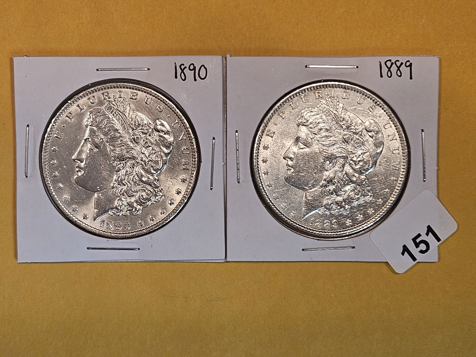 Two About Uncirculated Morgan Silver Dollars (1 of 3)