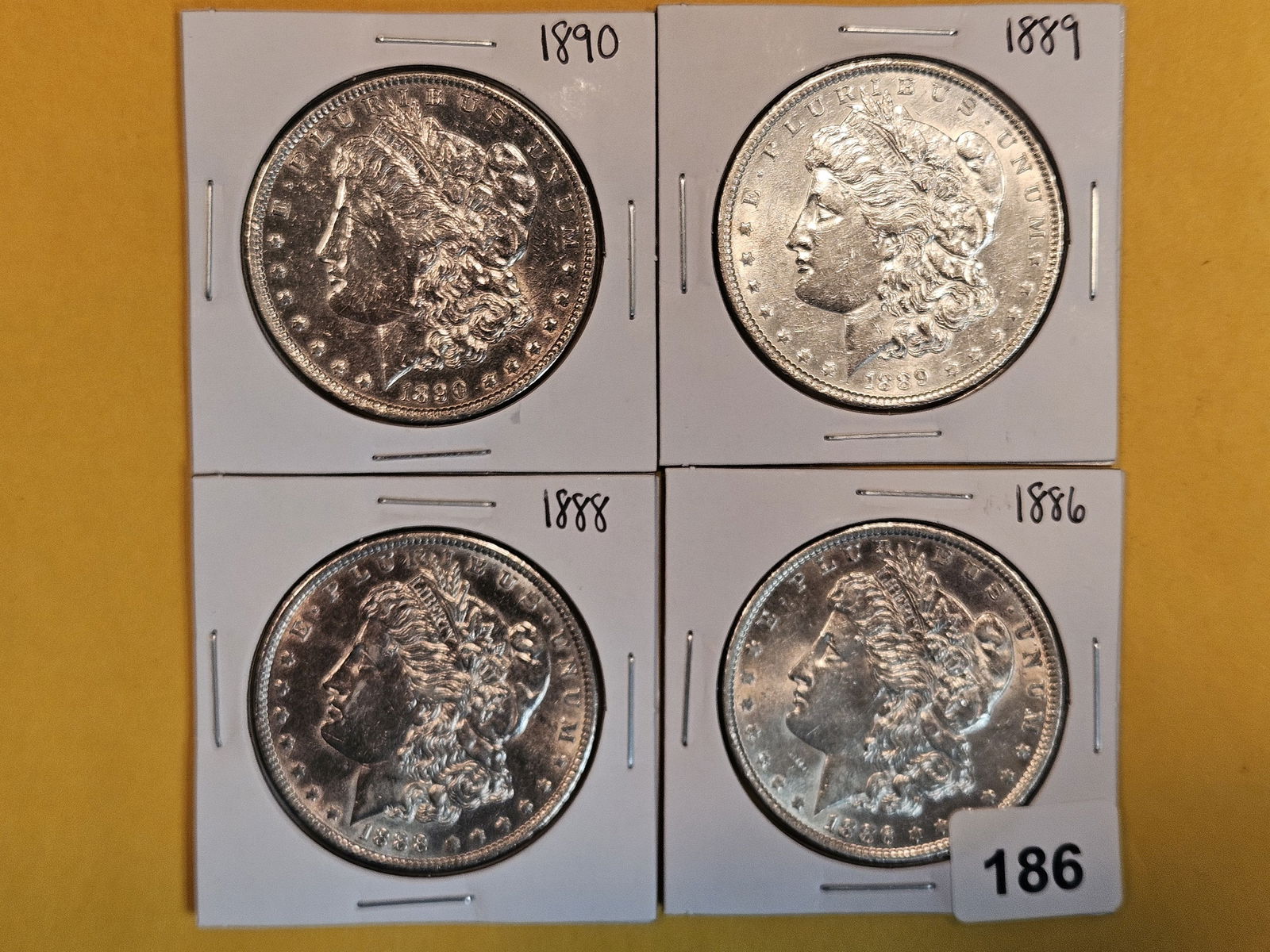 Four Mixed Morgan Silver Dollars (1 of 3)