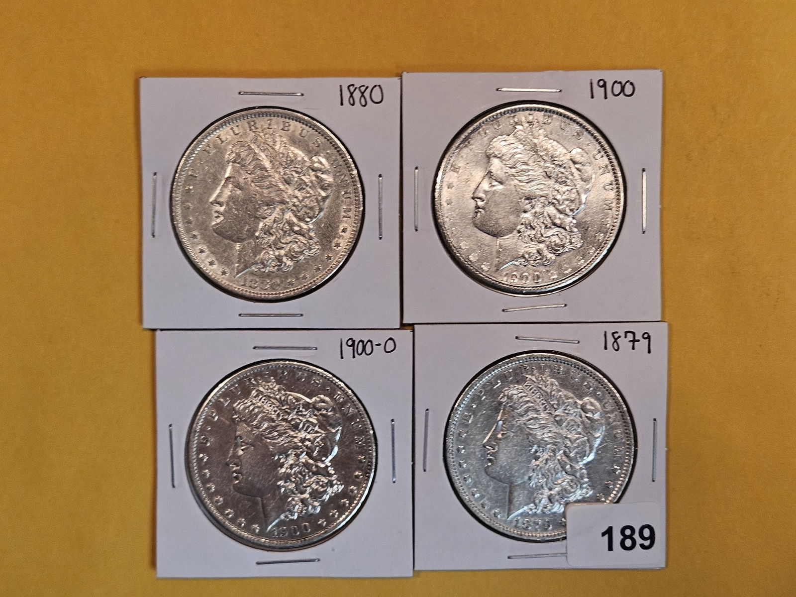 Four Mixed Morgan Silver Dollars (1 of 3)