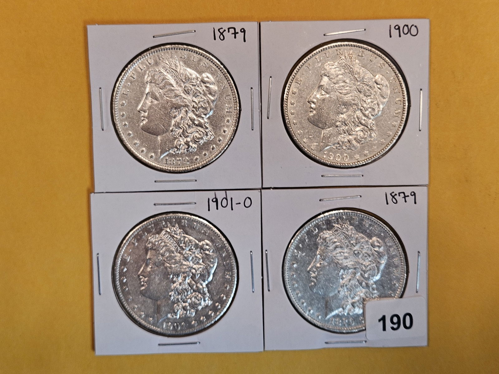 Four Mixed Morgan Silver Dollars (1 of 3)