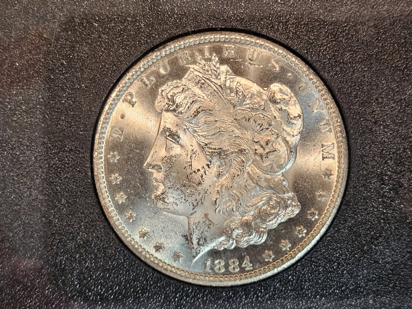 ** KEY DATE ** NGC GSA 1884-CC Morgan Dollar in Mint State 63: KEY DATE! CARSON CITY! Graded by NGC in original GSA holder! Very sharp with near reflective fields! Looks better than a 63!