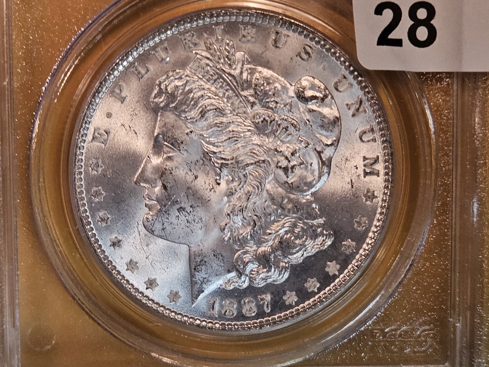 PCGS 1887 Morgan Dollar in Mint State 64: nice