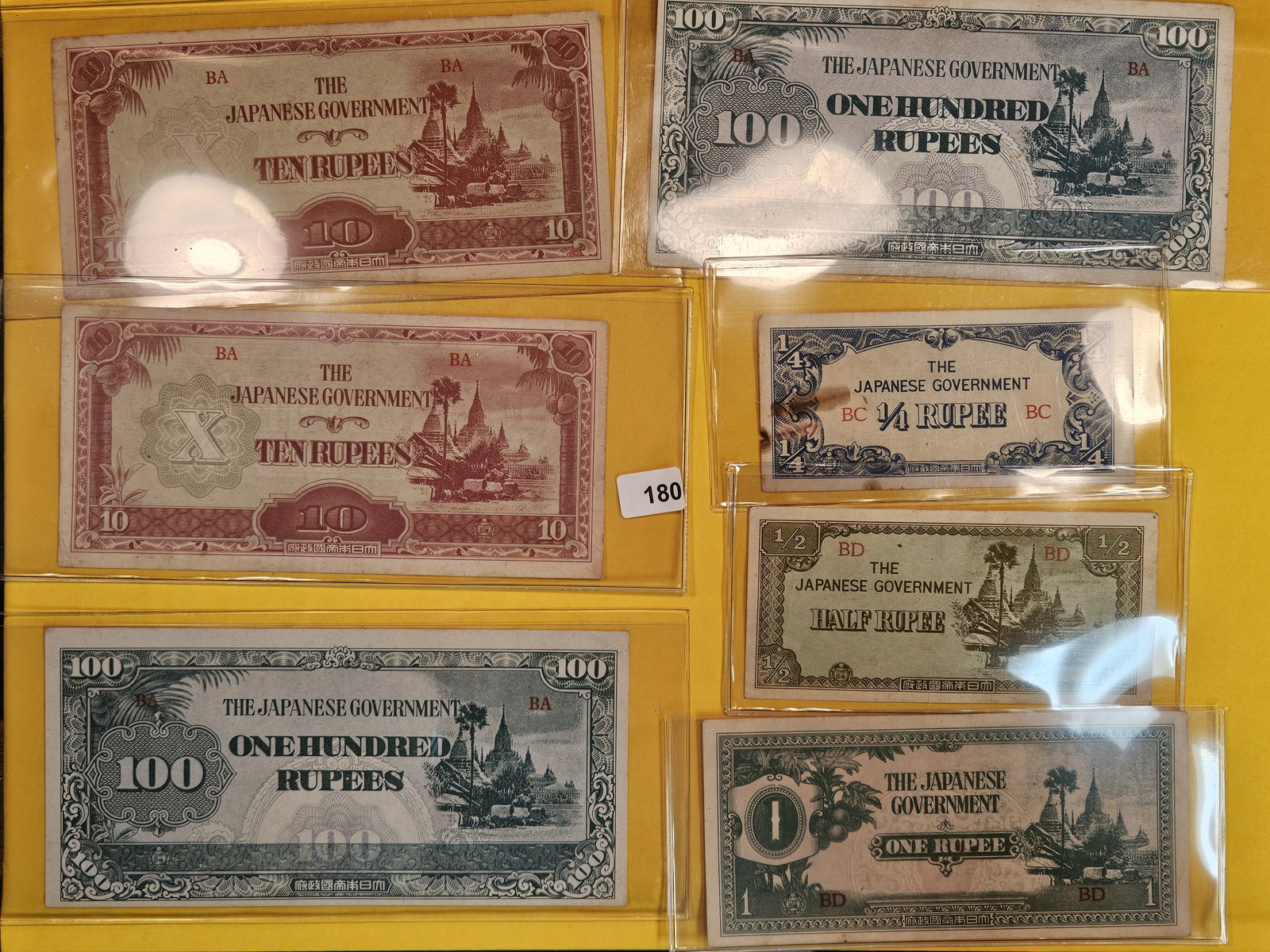 Seven mixed pieces of Japanese Invasion currency (1 of 4)