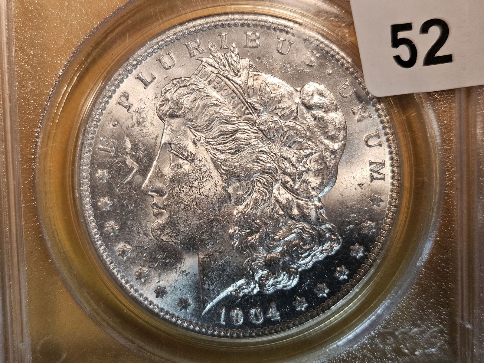 LABEL ERROR ** PCGS OGH 1904-O Morgan Dollar in MS-63 (1 of 5)