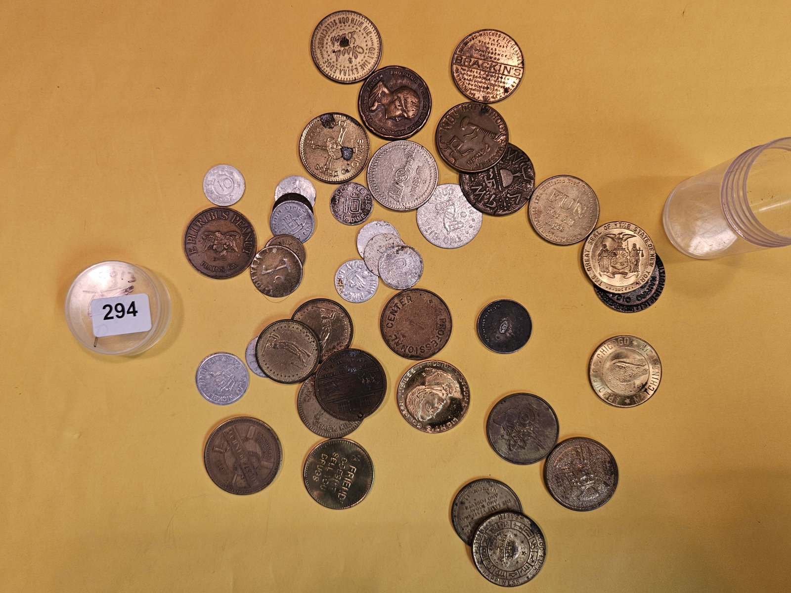 EXONUMIA!: Little tube with mixed tokens and medals