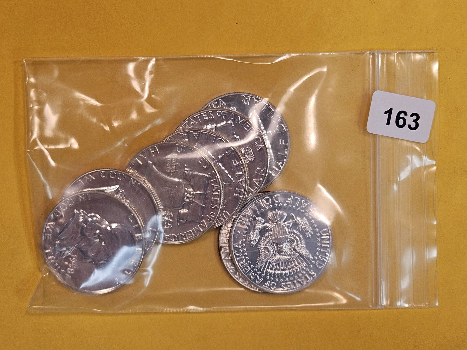Eight mixed GEM Proof and Brilliant Uncirculated silver Half Dollars (1 of 2)