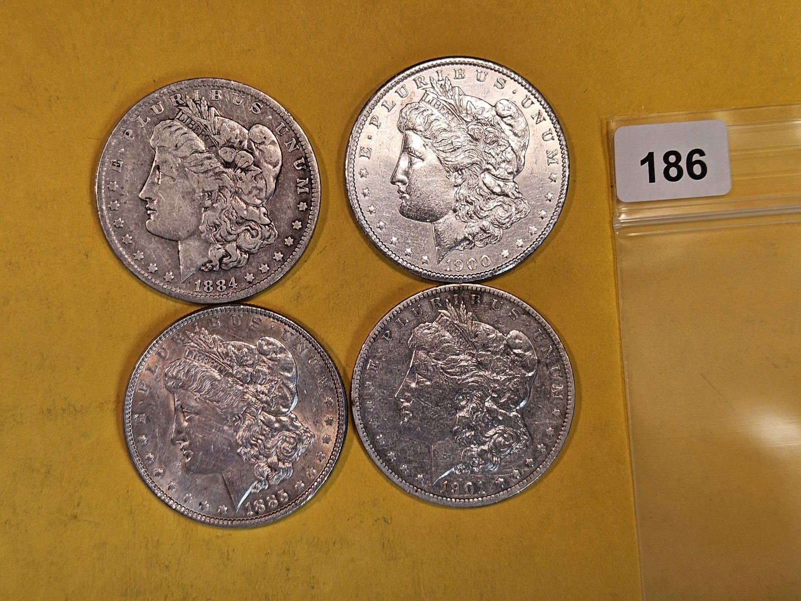 Four mixed Morgan Silver Dollars (1 of 2)
