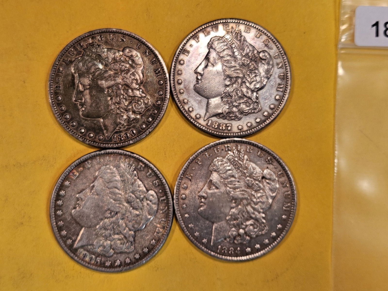 Four mixed Morgan Silver Dollars (1 of 2)