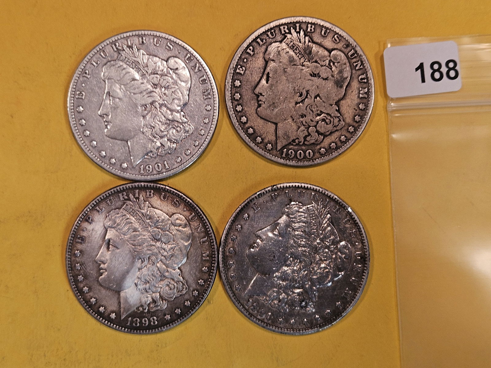 Four mixed Morgan Silver Dollars (1 of 2)