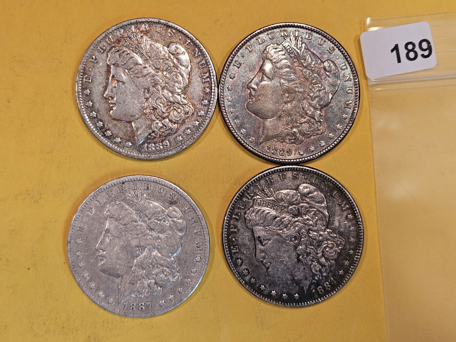 Four mixed Morgan Silver Dollars (1 of 2)