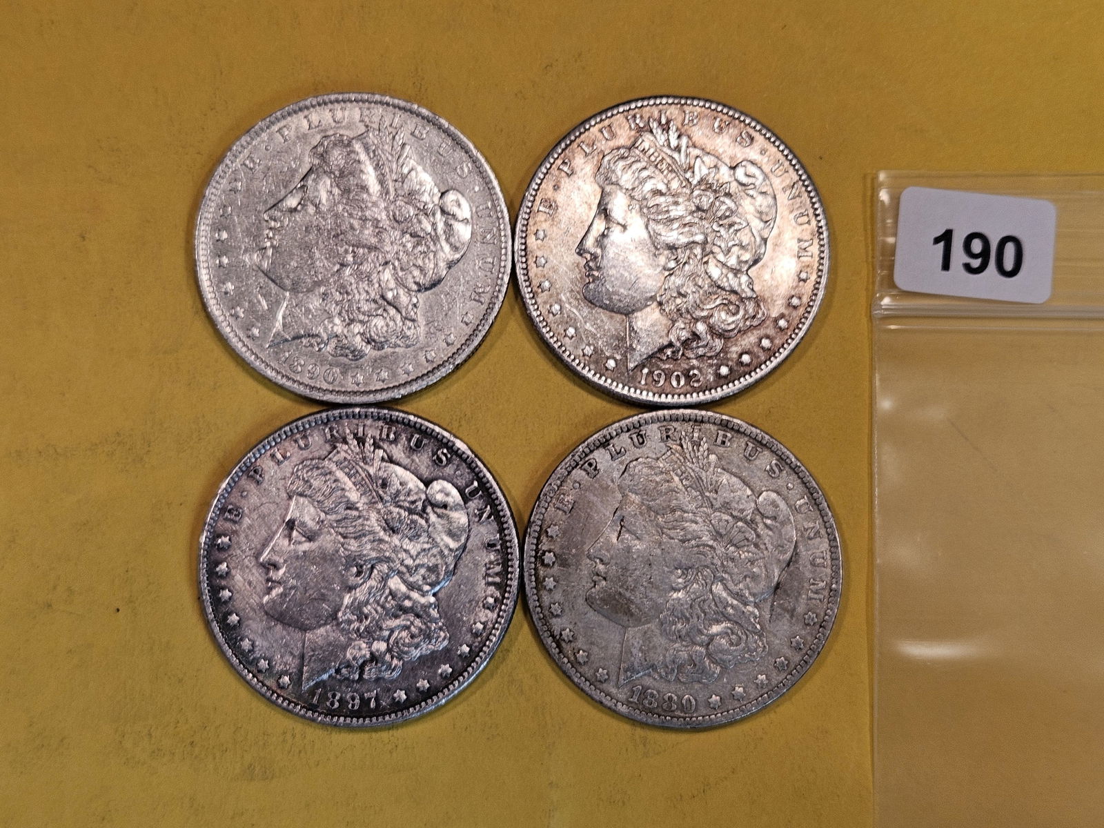 Four mixed Morgan Silver Dollars (1 of 2)