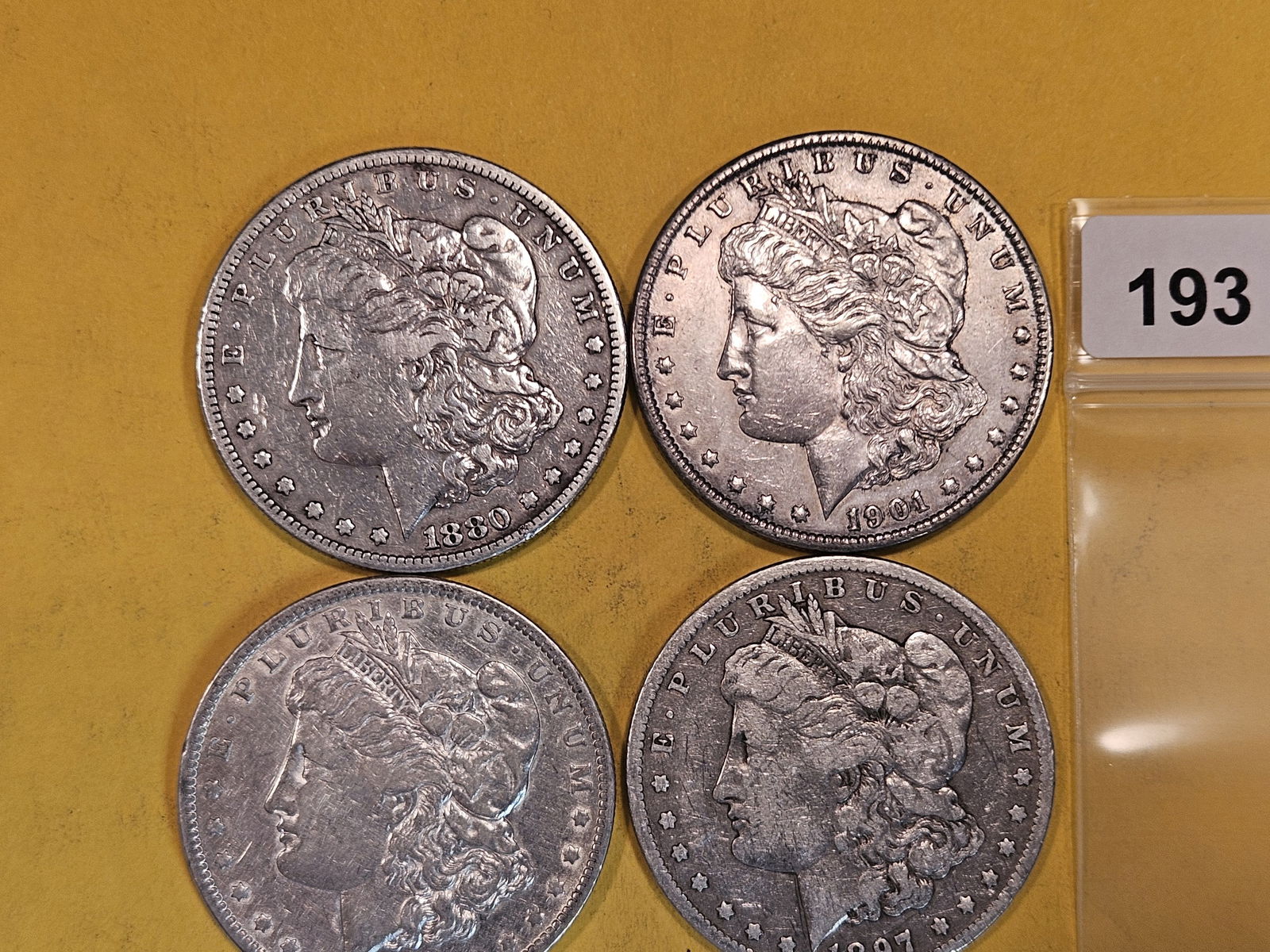 Four mixed Morgan Silver Dollars (1 of 2)