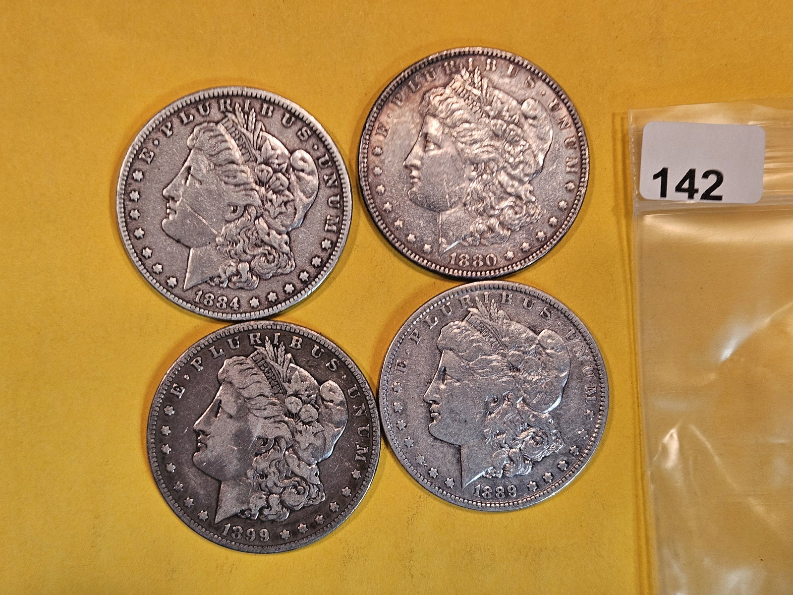Four Mixed Morgan Silver Dollars (1 of 2)