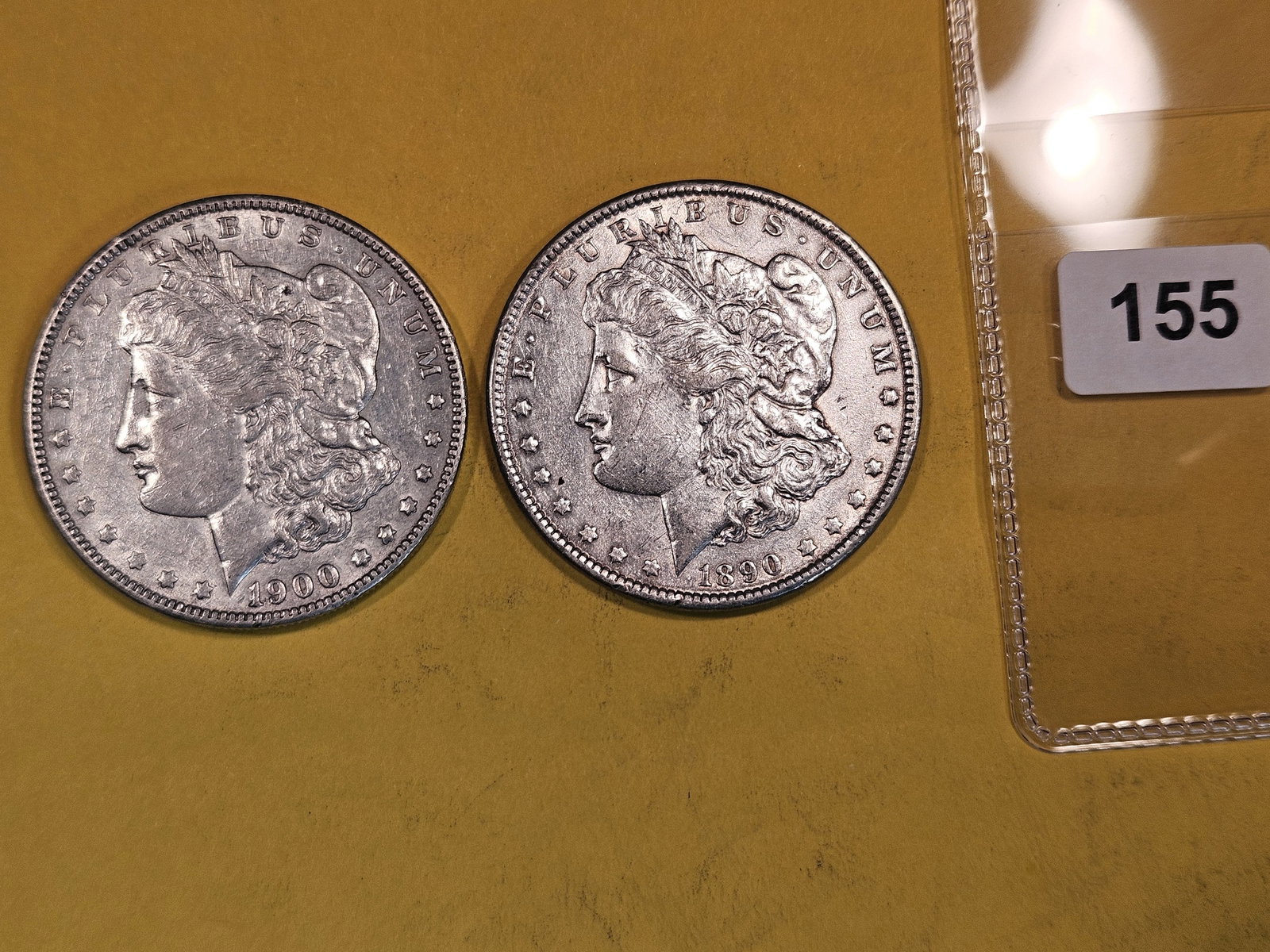 Two About Uncirculated Morgan Silver Dollars (1 of 2)