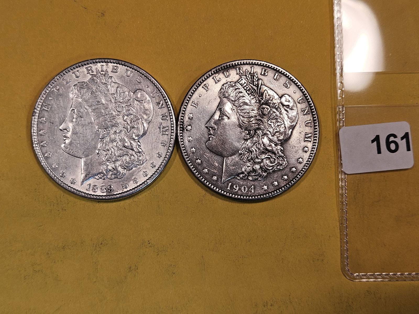 Two About Uncirculated Morgan Silver Dollars (1 of 2)