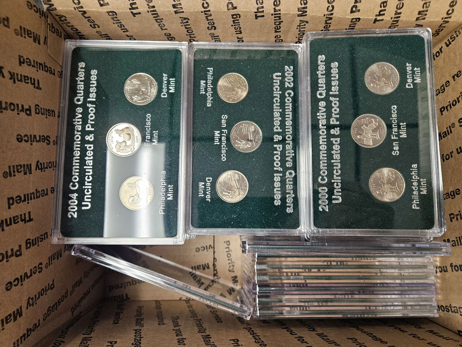 FIFTY Brilliant Uncirculated 3-coin US Quarters sets: Each plastic holder has 3 BU Statehood quarters. Ships separately in a Flat Rate Medium Box