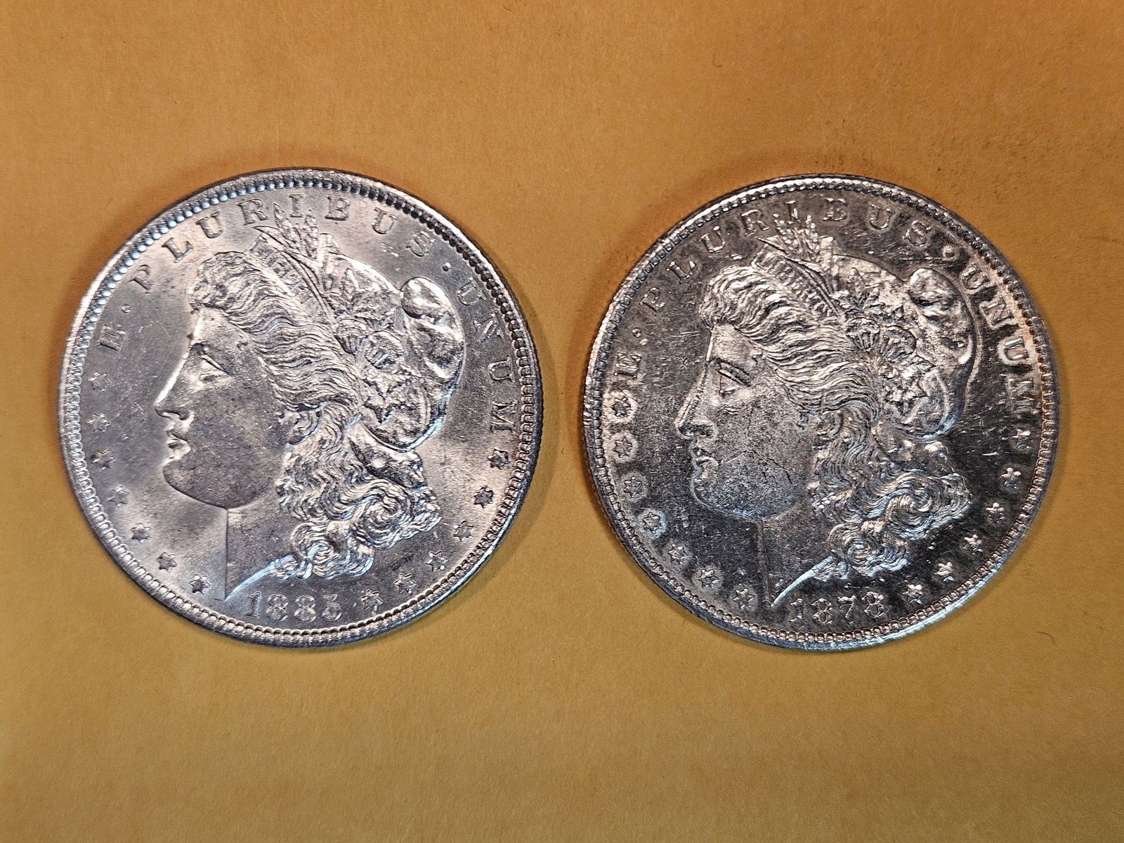 Two Brilliant About Uncirculated Morgan silver dollars (1 of 3)