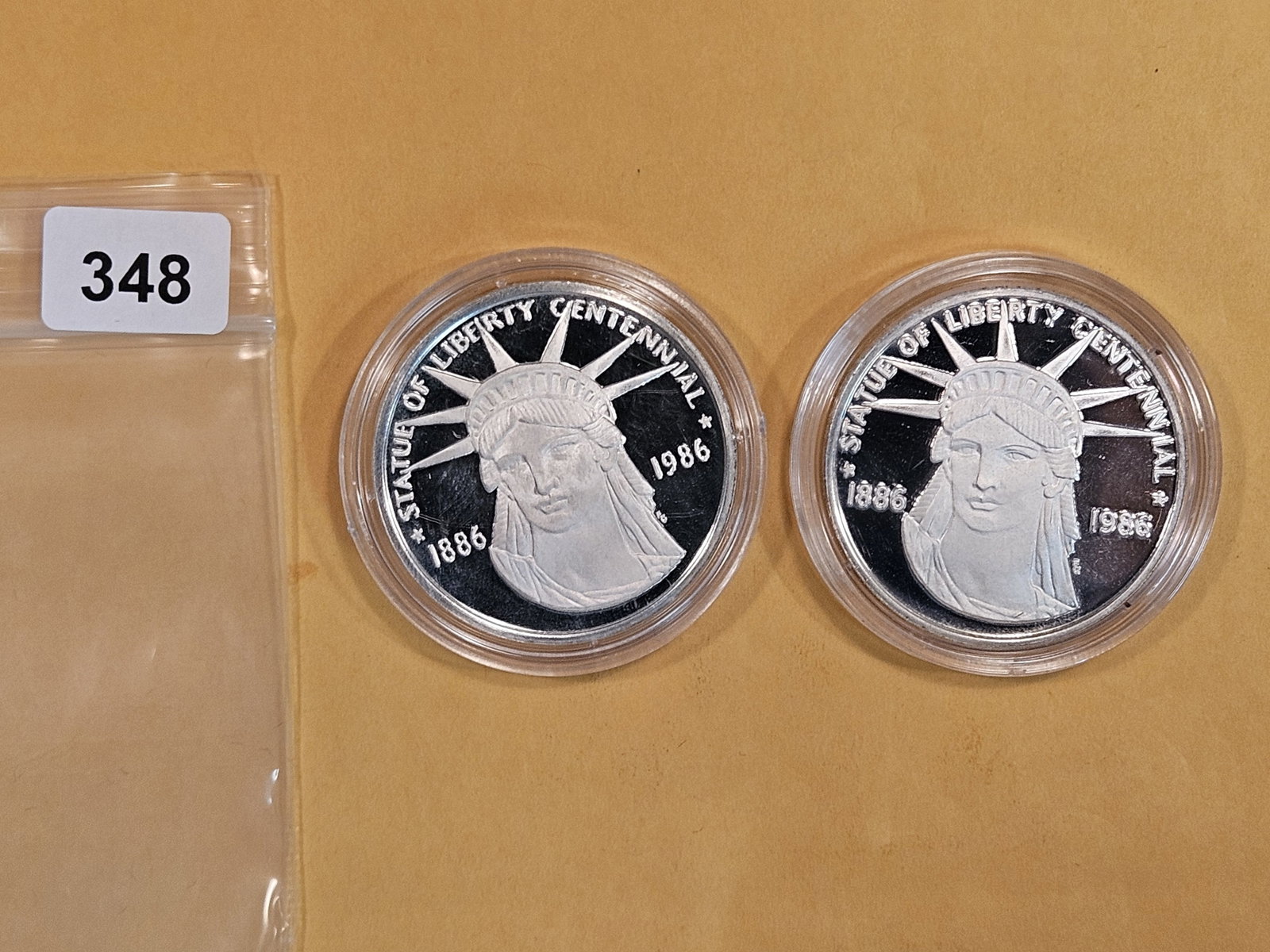 Two Silver Proof Deep Cameo Statue of Liberty Centennial Coins: Sterling Silver. Weighs 28.35 grams each