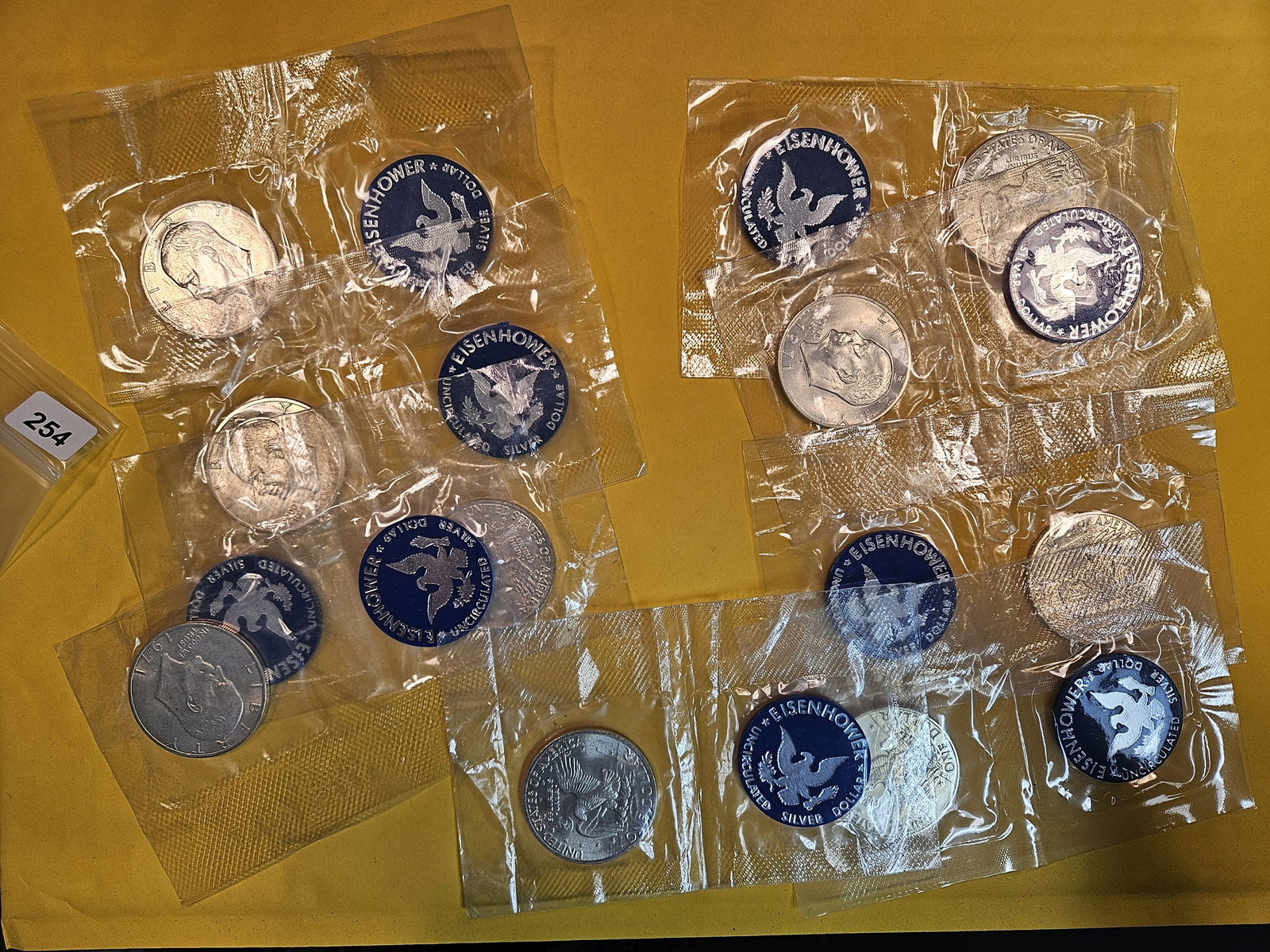 Nine mixed Brilliant Uncirculated silver Eisenhower Dollars (1 of 2)