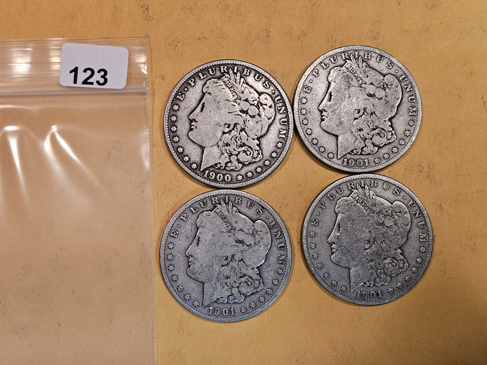Four mixed Morgan Silver Dollars (1 of 2)
