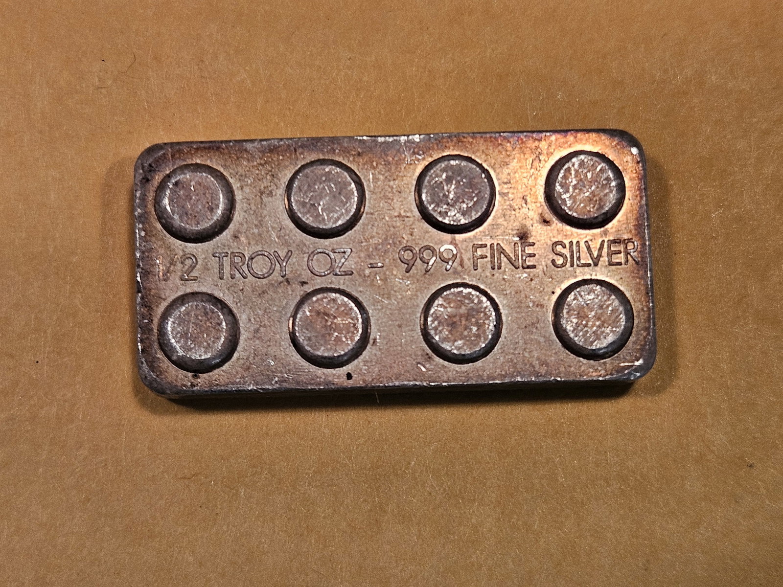 One-half troy ounce .999 fine silver bar: Shaped like a Lego brick