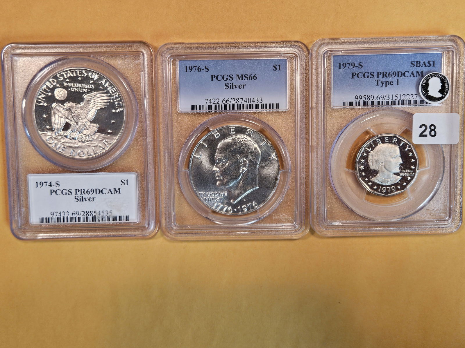 Three PCGS-graded Gem to near-perfect Dollars (1 of 2)