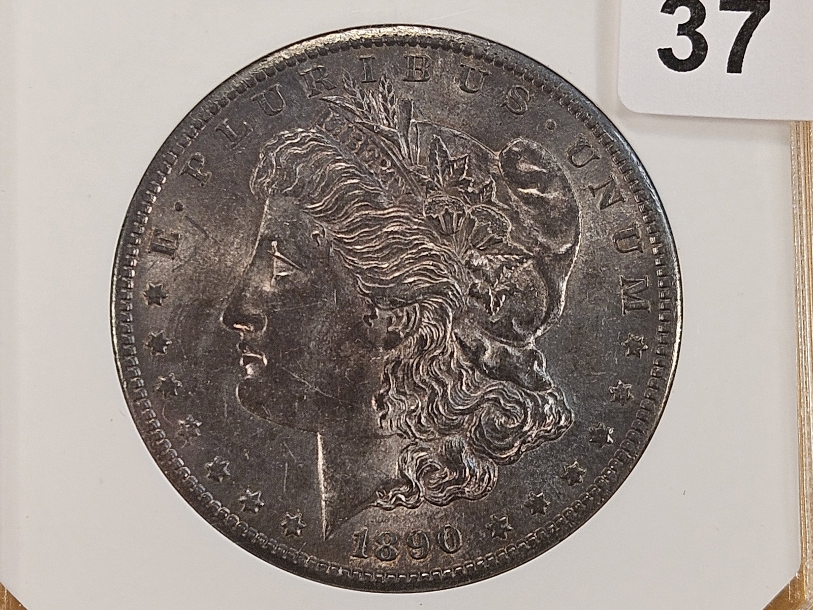 PCI 1890-S Morgan Silver Dollar labeled Mint State 65 plus: Cool toning from the PCI holder, grade is probably closer to MS-64.